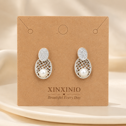 「XINXINIO」上品パール×きらめきストーンのオーバルピアス 大人可愛いシルバーデザイン 華やか オーバル パーティー 結婚式 プレゼント